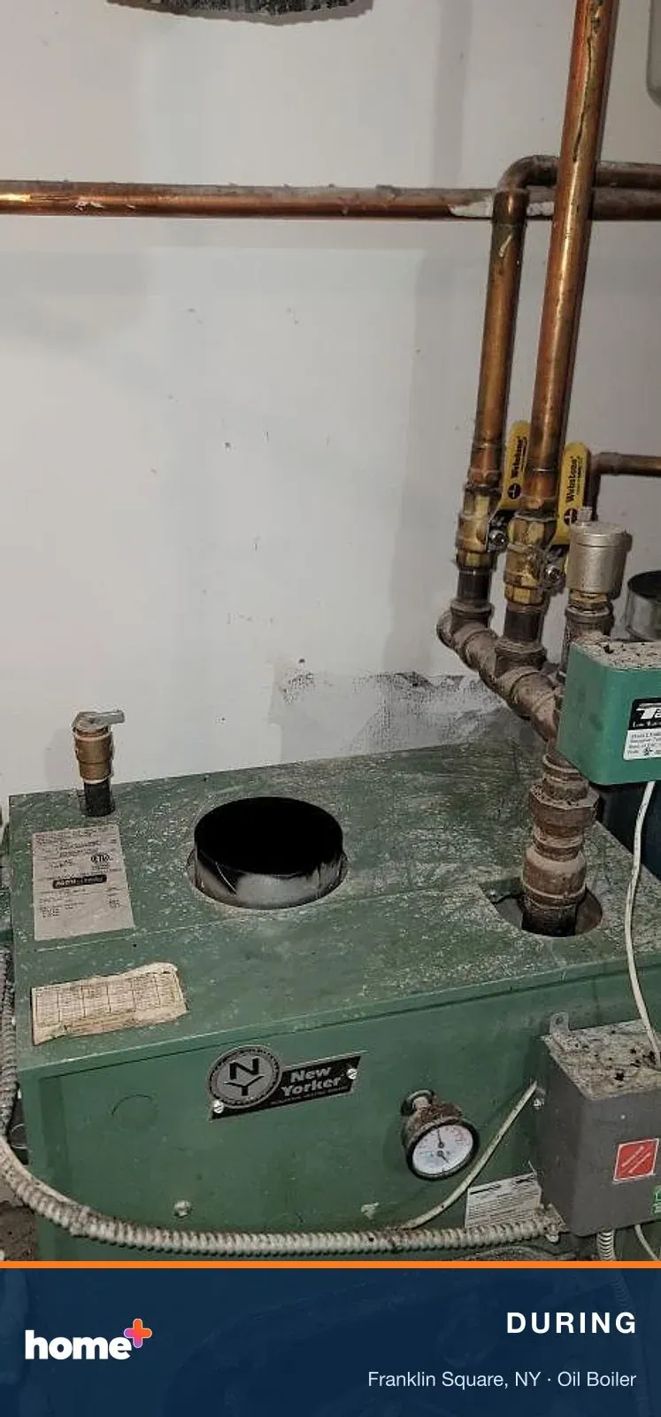 Flue pipe off: the boiler's flue outlet is opened up so the connector to the chimney can be cleaned and inspected.